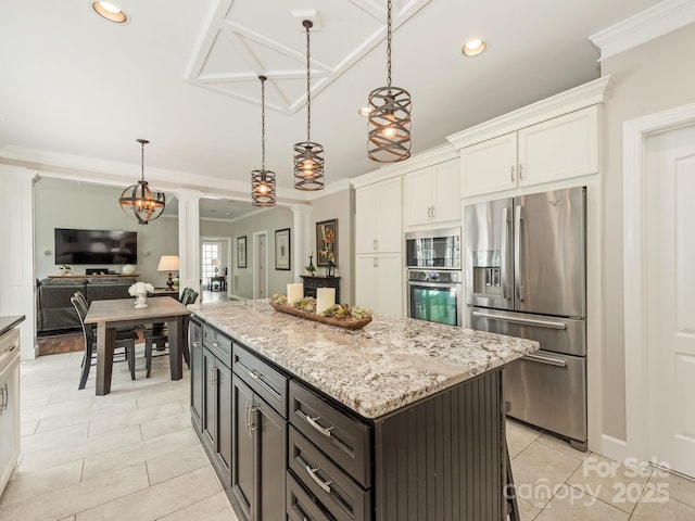 3721 Providence Plantation Ln, Charlotte, NC 28270 - kitchen featuring stainless steel appliances, ornate columns, light tile patterned flooring, white cabinets, and a kitchen island