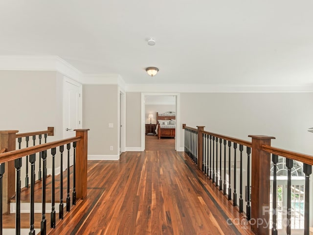 3721 Providence Plantation Ln, Charlotte, NC 28270 - hallway with an upstairs landing, dark wood finished floors, crown molding, and baseboards