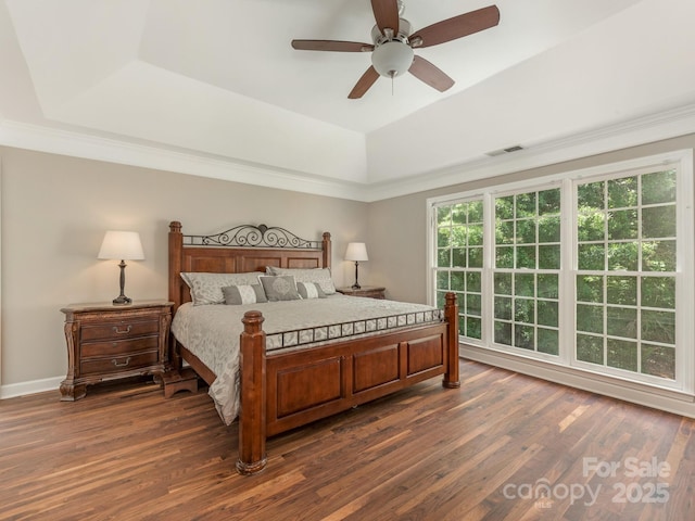 3721 Providence Plantation Ln, Charlotte, NC 28270 - bedroom with a raised ceiling, dark wood-style floors, a ceiling fan, and baseboards