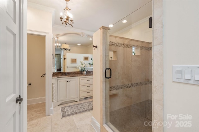 12048 Royal Portrush Dr, Charlotte, NC 28277 - full bathroom featuring a notable chandelier, a shower stall, ornamental molding, and vanity