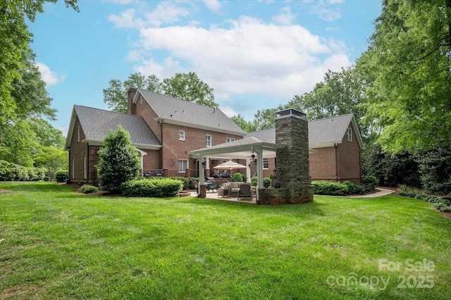 12048 Royal Portrush Dr, Charlotte, NC 28277 - back of property featuring a lawn, brick siding, a patio area, and a chimney
