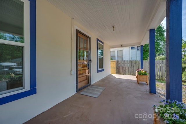 view of patio / terrace featuring fence
