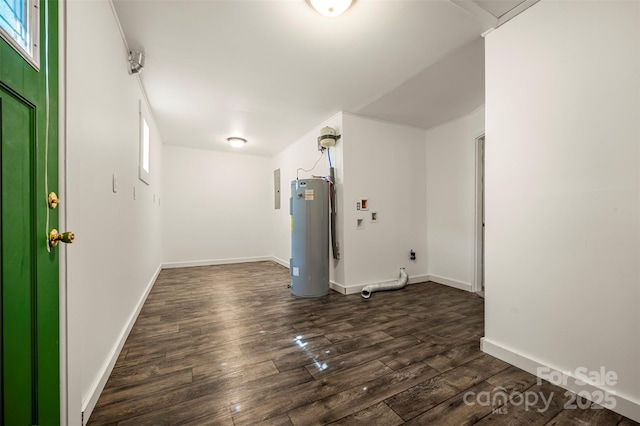 interior space featuring baseboards, a healthy amount of sunlight, dark wood-style floors, and electric water heater
