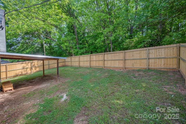 view of yard with a fenced backyard