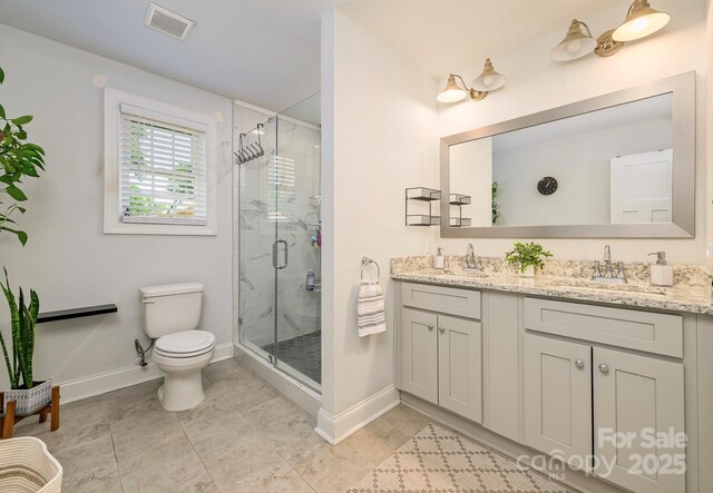 4838 Holbrook Dr, Charlotte, NC 28212 - full bath with toilet, baseboards, a stall shower, and double vanity