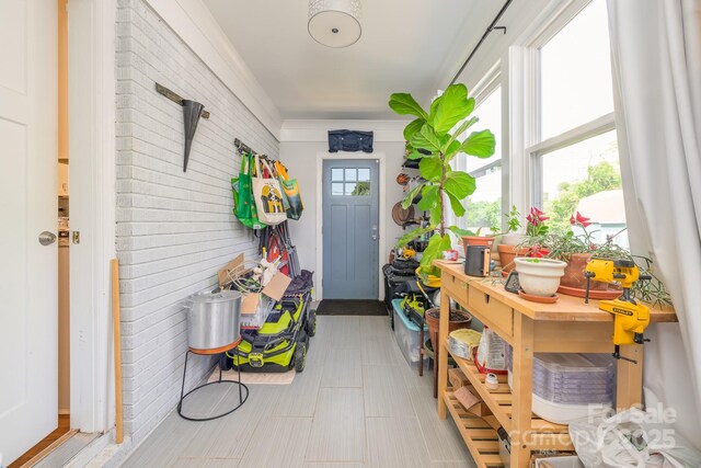 4838 Holbrook Dr, Charlotte, NC 28212 - mudroom featuring brick wall