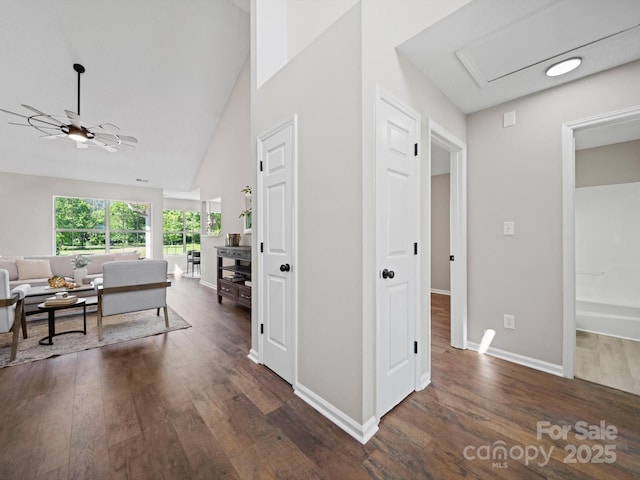 4101 New Castle Ln, Monroe, NC 28110 - hallway with dark wood finished floors, baseboards, and high vaulted ceiling