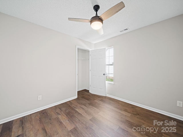 4101 New Castle Ln, Monroe, NC 28110 - empty room featuring a ceiling fan, wood finished floors, baseboards, and a textured ceiling