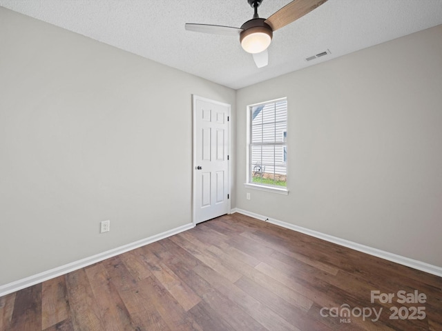 4101 New Castle Ln, Monroe, NC 28110 - spare room featuring baseboards, wood finished floors, a ceiling fan, and a textured ceiling