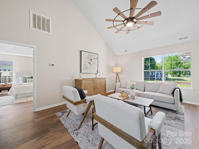 4101 New Castle Ln, Monroe, NC 28110 - living room with high vaulted ceiling, wood finished floors, a ceiling fan, and baseboards