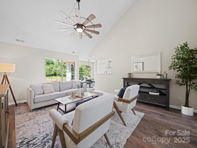 4101 New Castle Ln, Monroe, NC 28110 - living room with a ceiling fan, high vaulted ceiling, baseboards, and dark wood-style flooring
