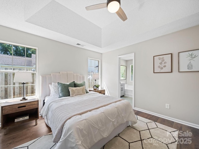 4101 New Castle Ln, Monroe, NC 28110 - bedroom with dark wood-type flooring, multiple windows, and baseboards