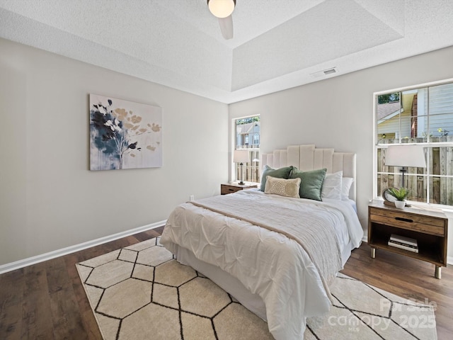 4101 New Castle Ln, Monroe, NC 28110 - bedroom with wood finished floors, baseboards, a raised ceiling, and a ceiling fan