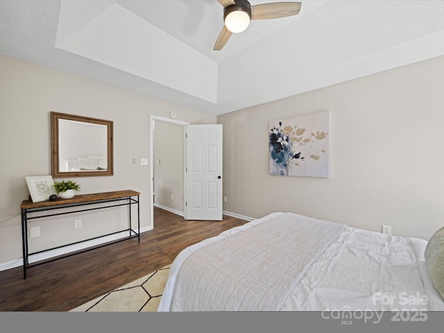 4101 New Castle Ln, Monroe, NC 28110 - bedroom featuring wood finished floors, a raised ceiling, baseboards, and ceiling fan