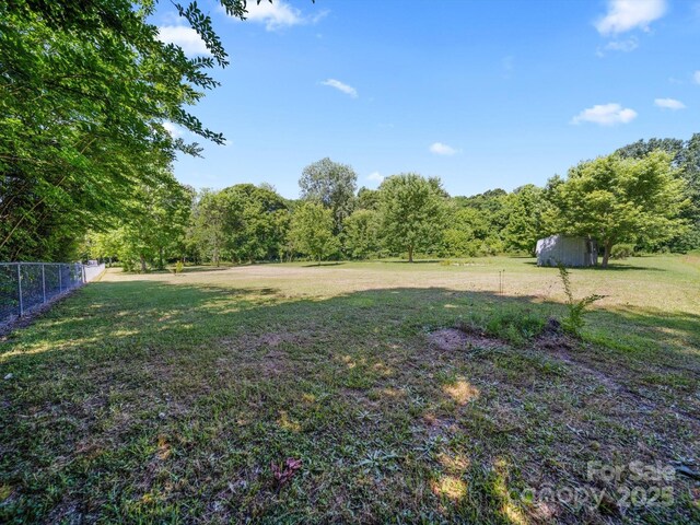 4101 New Castle Ln, Monroe, NC 28110 - view of yard featuring a wooded view