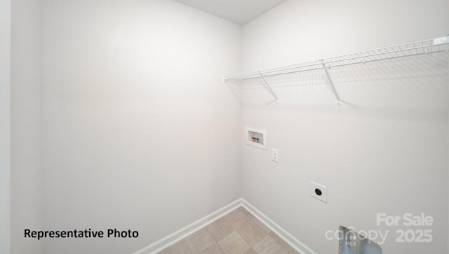 washroom with washer hookup, baseboards, laundry area, and electric dryer hookup