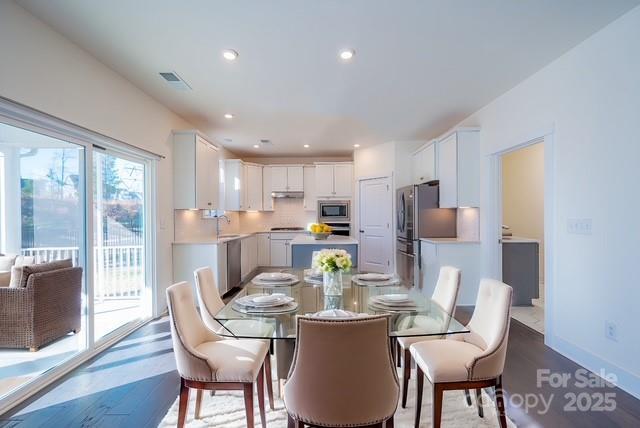 1540 Striped Bass Ln, Clover, SC 29710 - dining area featuring baseboards, recessed lighting, and wood finished floors