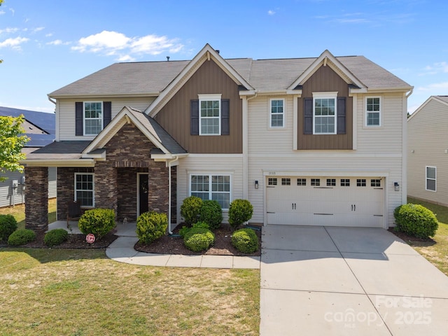 13315 Hunting Birds Ln, Charlotte, NC 28278 - view of front of house with a garage, concrete driveway, a front lawn, board and batten siding, and stone siding