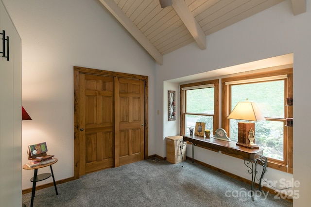 entryway featuring baseboards, carpet floors, and wooden ceiling