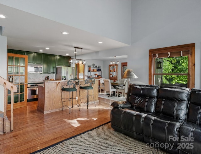141 Ivy Ridge Rd, Burnsville, NC 28714 - living room featuring light wood finished floors, a chandelier, and recessed lighting