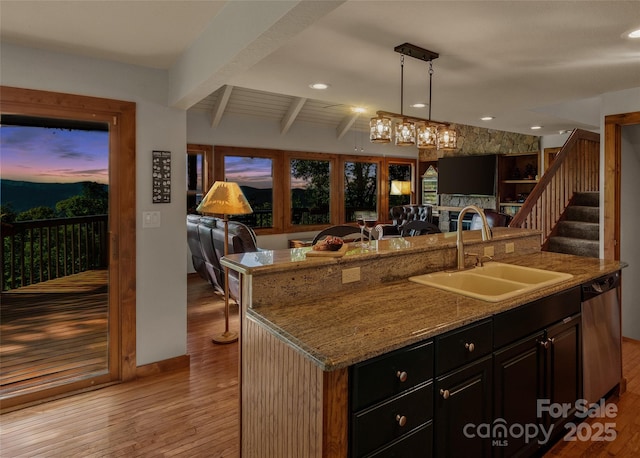 141 Ivy Ridge Rd, Burnsville, NC 28714 - kitchen with a sink, open floor plan, stainless steel dishwasher, an island with sink, and light wood finished floors