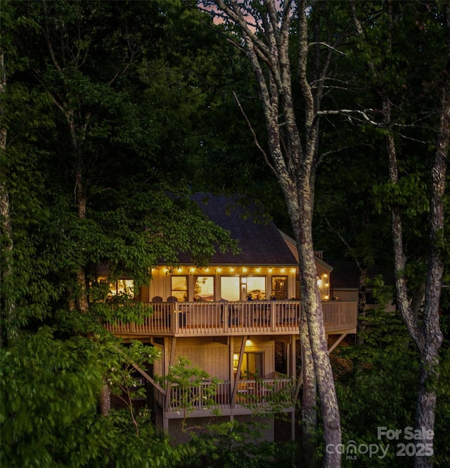 141 Ivy Ridge Rd, Burnsville, NC 28714 - rear view of house with a wooden deck and a shingled roof