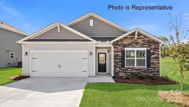 249 Giant Oak Ave, Statesville, NC 28677 - craftsman-style house featuring stone siding, a front yard, driveway, an attached garage, and a shingled roof