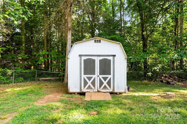 view of shed featuring a fenced backyard