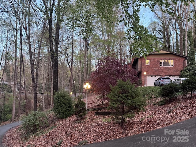 231 Davis Dr, Morganton, NC 28655 - view of property exterior with brick siding and a garage