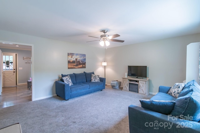 living room featuring carpet, ceiling fan, baseboards, and recessed lighting