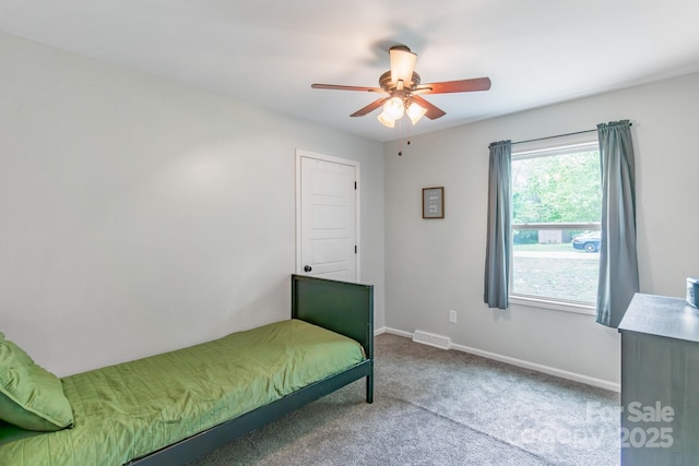 bedroom featuring carpet, baseboards, and ceiling fan