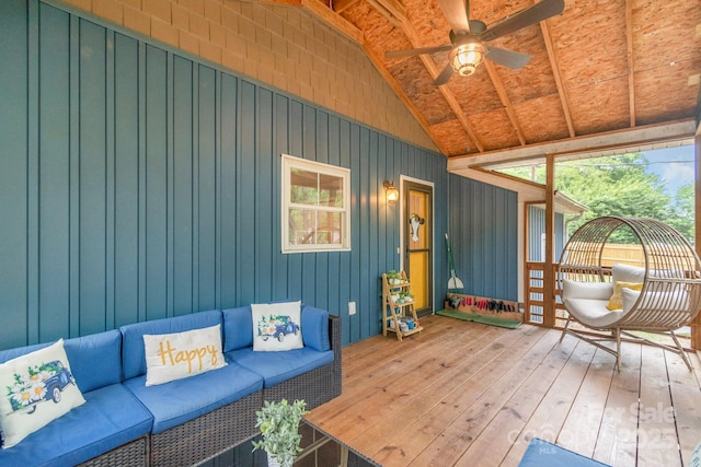 unfurnished sunroom with lofted ceiling, an outdoor living space, and ceiling fan