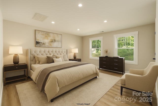bedroom with visible vents, recessed lighting, and light wood-style flooring