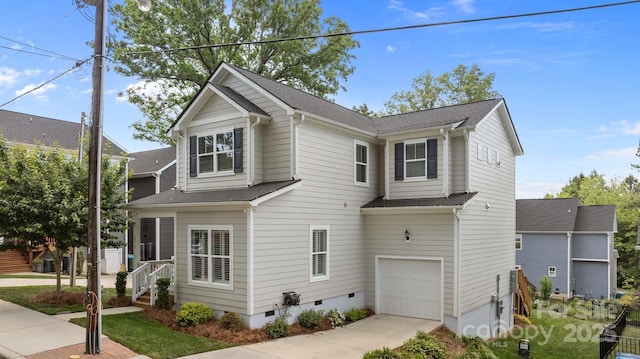 view of front of home featuring roof with shingles, driveway, a garage, and crawl space