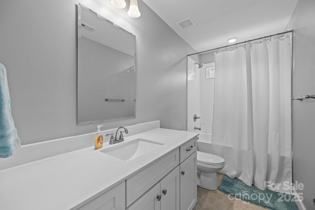 full bath with vanity, toilet, visible vents, and shower / bath combination with curtain