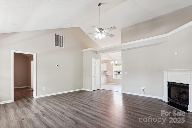 unfurnished living room featuring high vaulted ceiling, a chandelier, a fireplace with flush hearth, dark wood-style flooring, and ceiling fan