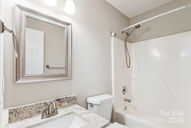 bathroom with toilet, vanity, and bathtub / shower combination
