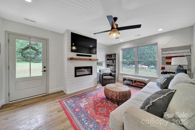 456 Rainbow Cir, Clover, SC 29710 - living room with light wood-style flooring, a large fireplace, a ceiling fan, recessed lighting, and baseboards