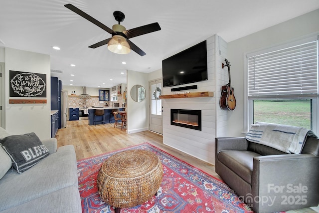 456 Rainbow Cir, Clover, SC 29710 - living area featuring light wood-style floors, a fireplace, a ceiling fan, and recessed lighting