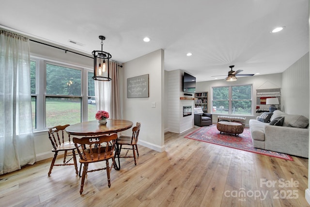 456 Rainbow Cir, Clover, SC 29710 - dining area featuring a glass covered fireplace, plenty of natural light, a ceiling fan, baseboards, and recessed lighting
