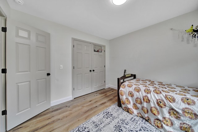 456 Rainbow Cir, Clover, SC 29710 - bedroom featuring light wood finished floors, baseboards, and a closet