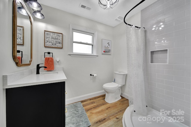 456 Rainbow Cir, Clover, SC 29710 - bathroom with wood finished floors, a tile shower, vanity, toilet, and baseboards