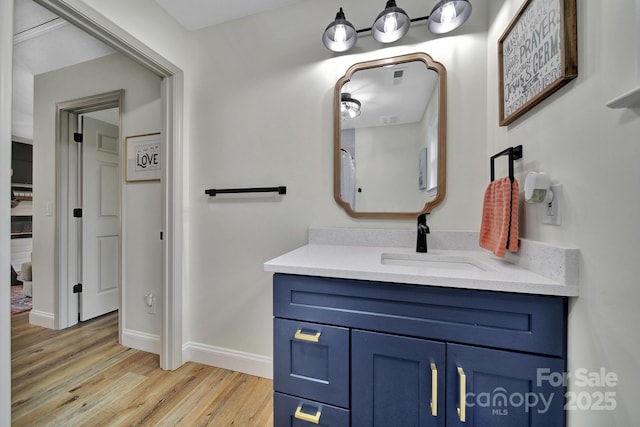 456 Rainbow Cir, Clover, SC 29710 - bathroom with wood finished floors, vanity, and baseboards