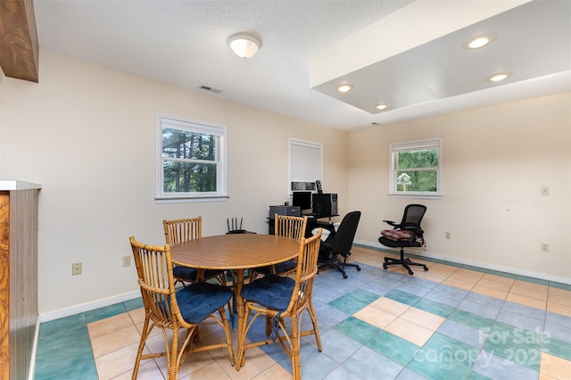 dining room with recessed lighting, baseboards, and light tile patterned floors
