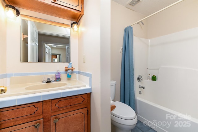 bathroom with toilet, visible vents, shower / tub combo, and vanity