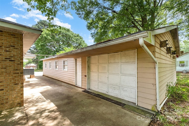 detached garage featuring driveway