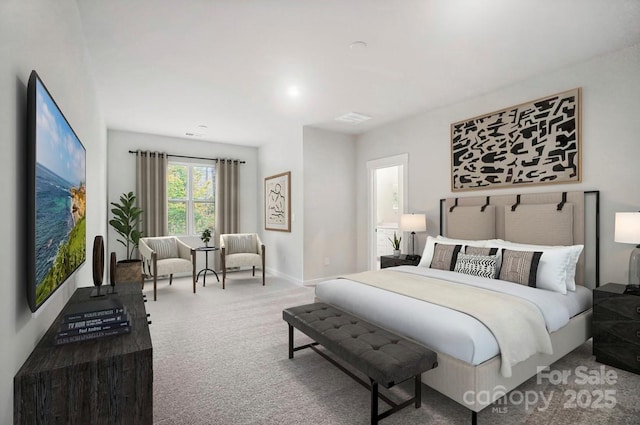 bedroom with carpet flooring and baseboards
