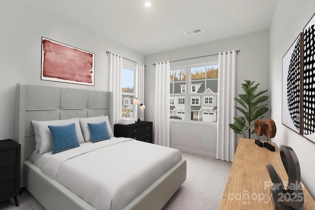 carpeted bedroom with baseboards
