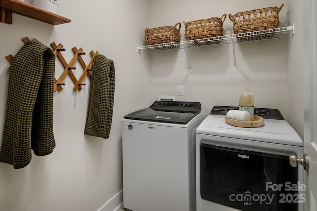 clothes washing area featuring independent washer and dryer