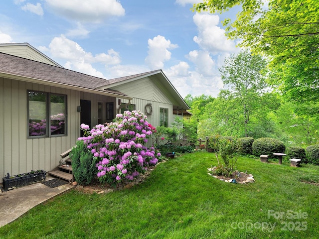 112 Deerlake Dr, Asheville, NC 28803 - view of property exterior with a yard and roof with shingles